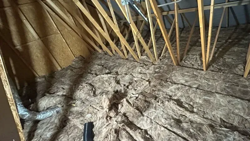 Before loft transformation - cluttered and underutilised space