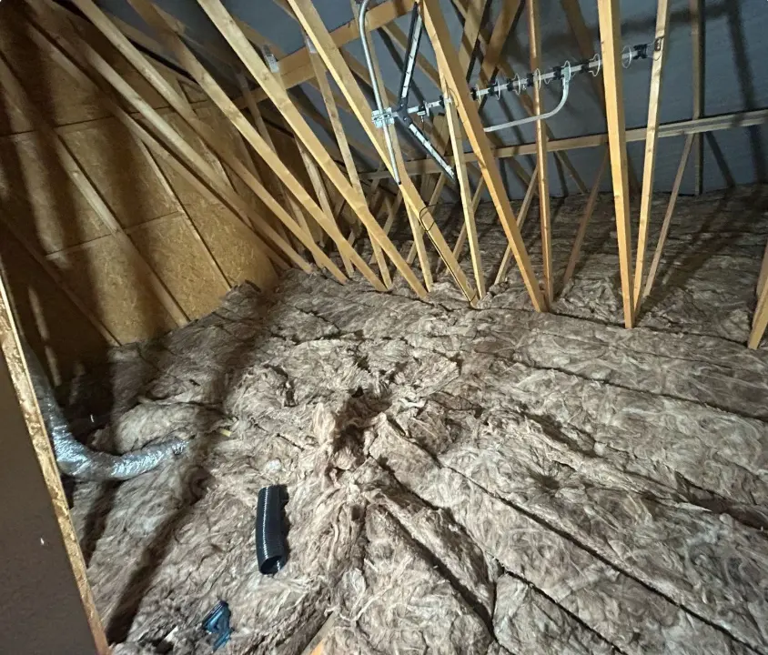 Before loft transformation - cluttered and underutilised space